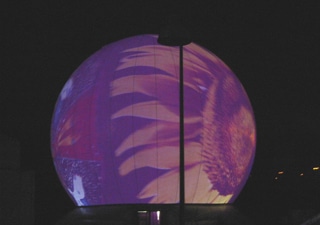 Lighted inflatable globe with light effects